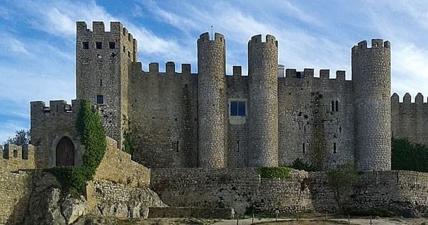 From Lisbon: Private Tour to Obidos, Nazare and Fatima with Drop-off in Porto