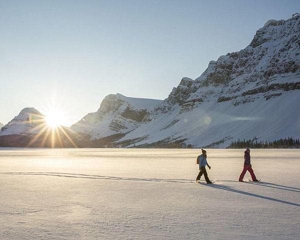 Snowshoeing in Scenic Landscape - TeslaX Electric Car