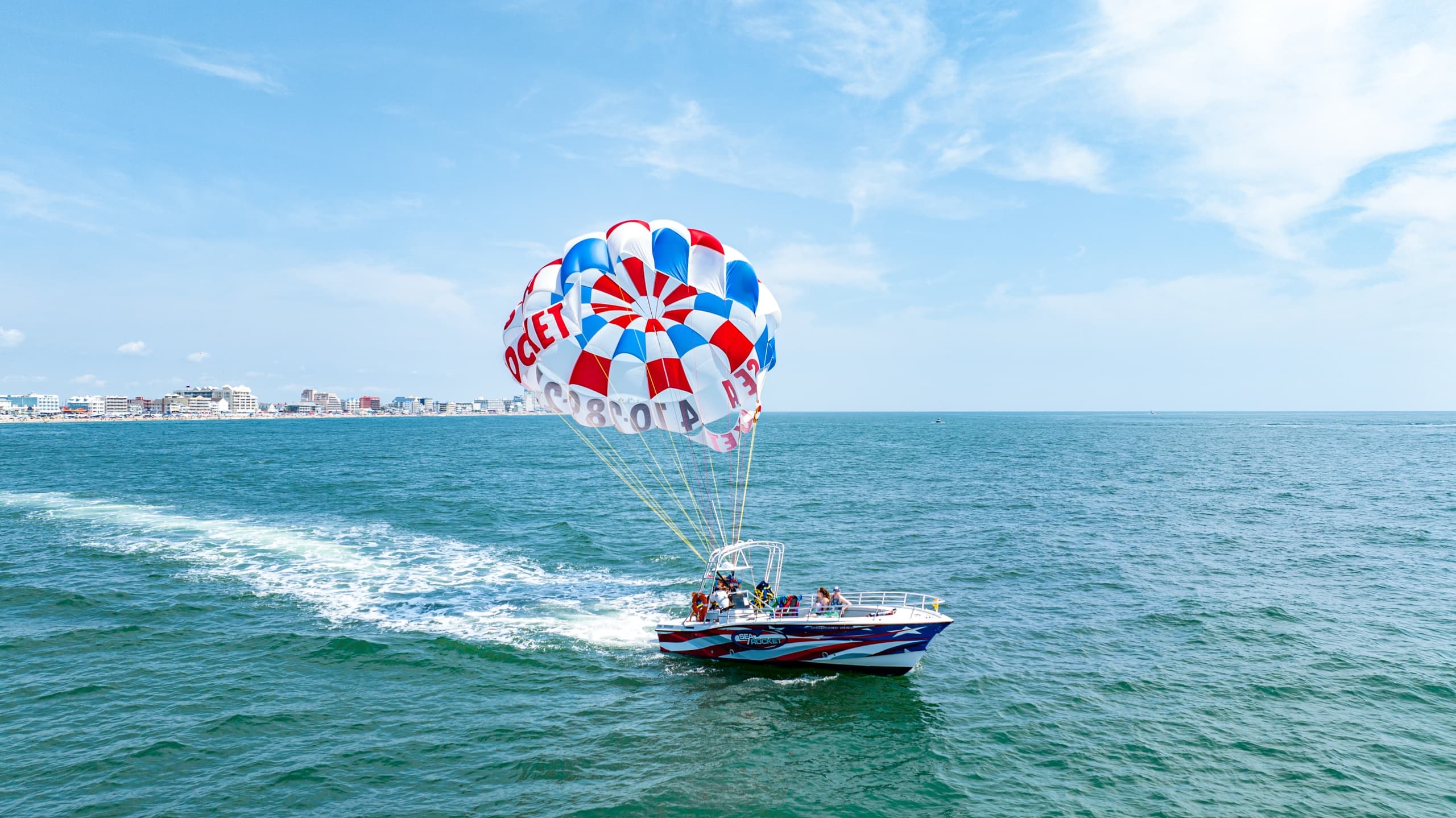 OCEAN PARASAILING & FREE SPEED BOAT/ DOLPHIN CRUISE COMBO PACKAGE