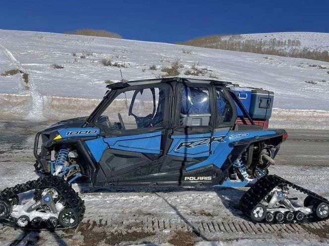 Polaris RZR w/ Snow Tracks