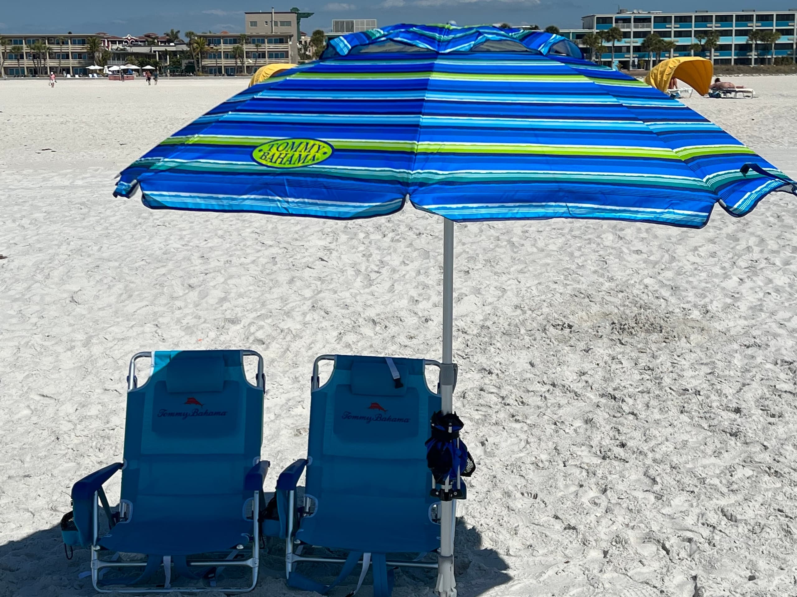 Two beach chairs and one umbrella
