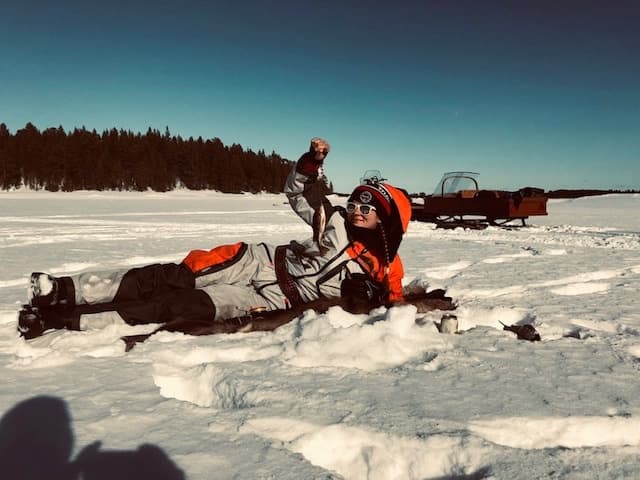 Ice fishing in lake Inari