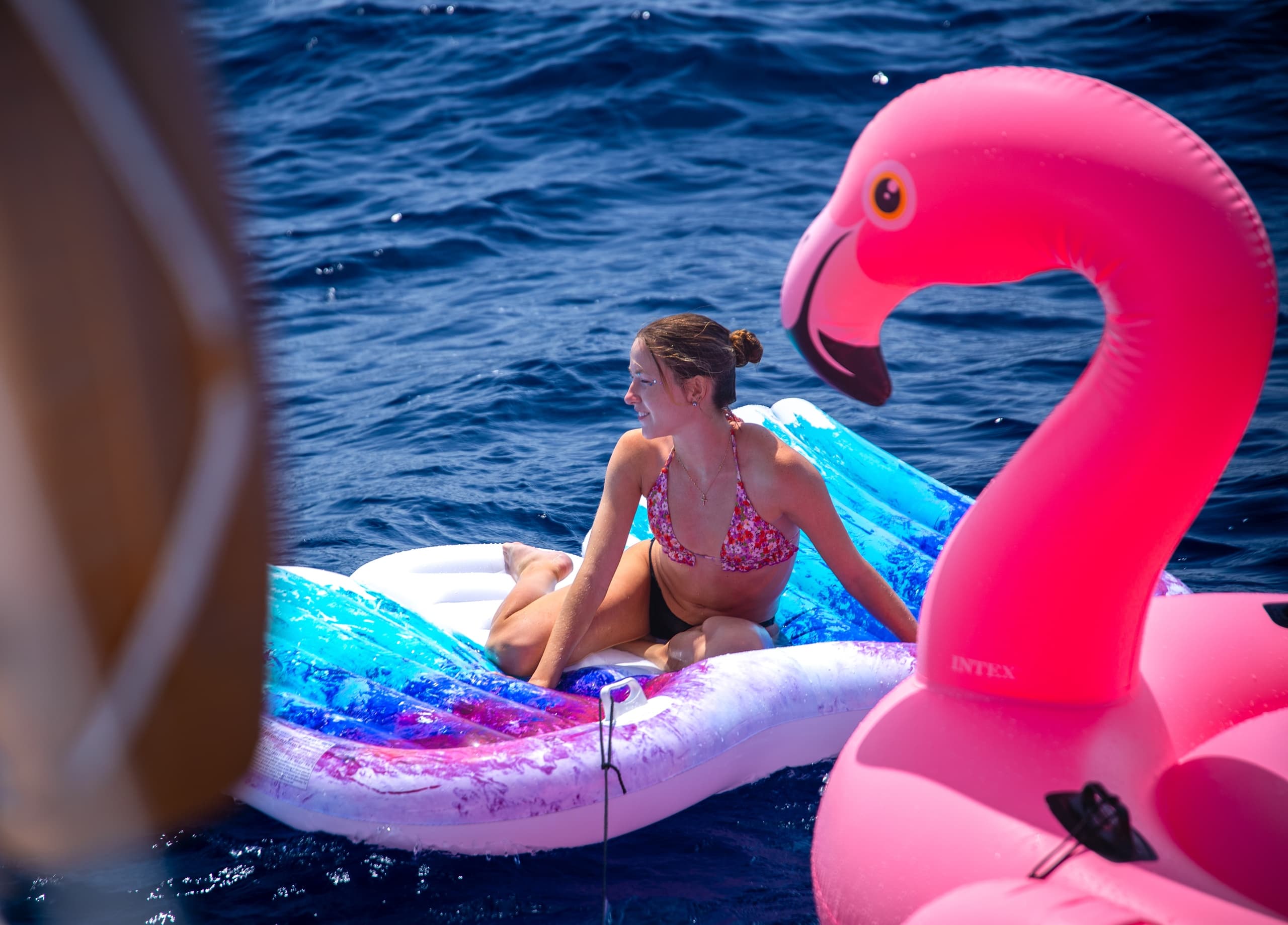 Fun in the Sun: Swimming, Inflatables, and Sailing Tour of Barcelona.